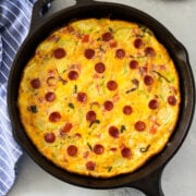 Pizza Frittata in a skillet with bread on the side