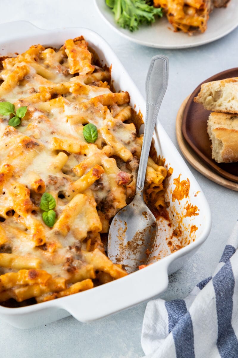 close up of ricotta baked ziti with serving spoon