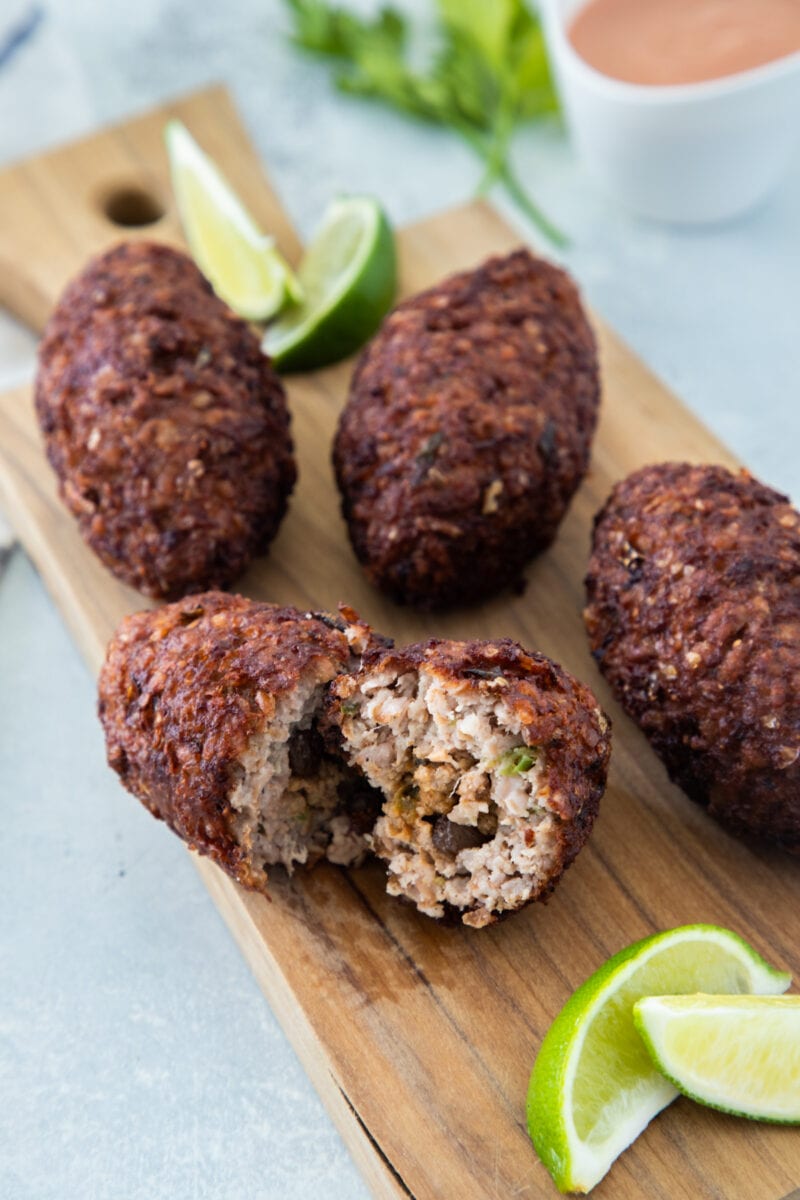 Dominican Food - Kipe served in a wooden board with lime slices