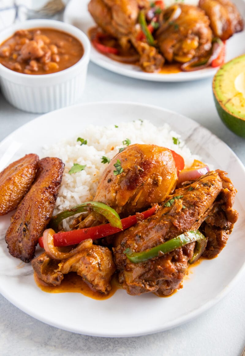 Dominican Food “The Dominican Flag” or La Bandera Dominicana, pollo guisado served with white rice and beans