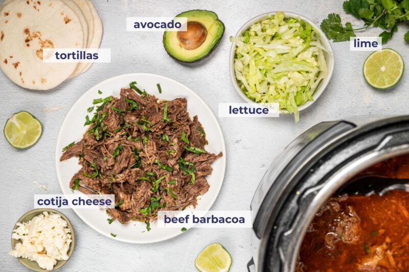 barbacoa tacos ingredients laid on a table