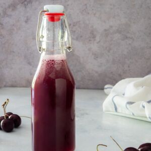 Cherry simple syrup in a sealed bottle