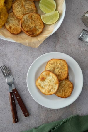 Crispy Dominican batata fries, golden and lightly salted—served with lime for the perfect sweet-savory bite.