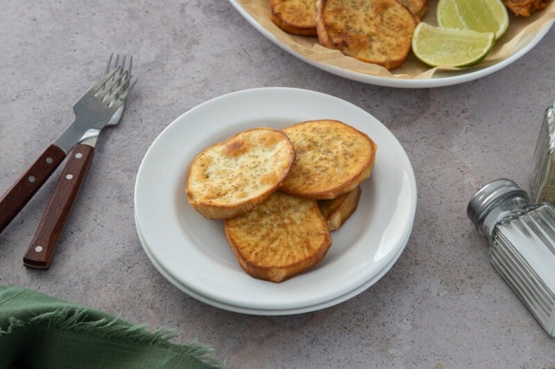 Crispy Dominican batata fries, golden and lightly salted—served with lime for the perfect sweet-savory bite.