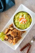 Crispy chicharrón served with creamy guacamole—perfectly golden bites with a flavorful dip.