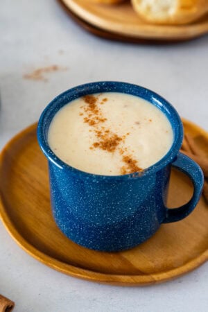 Creamy Dominican hot oatmeal topped with cinnamon in a blue mug.