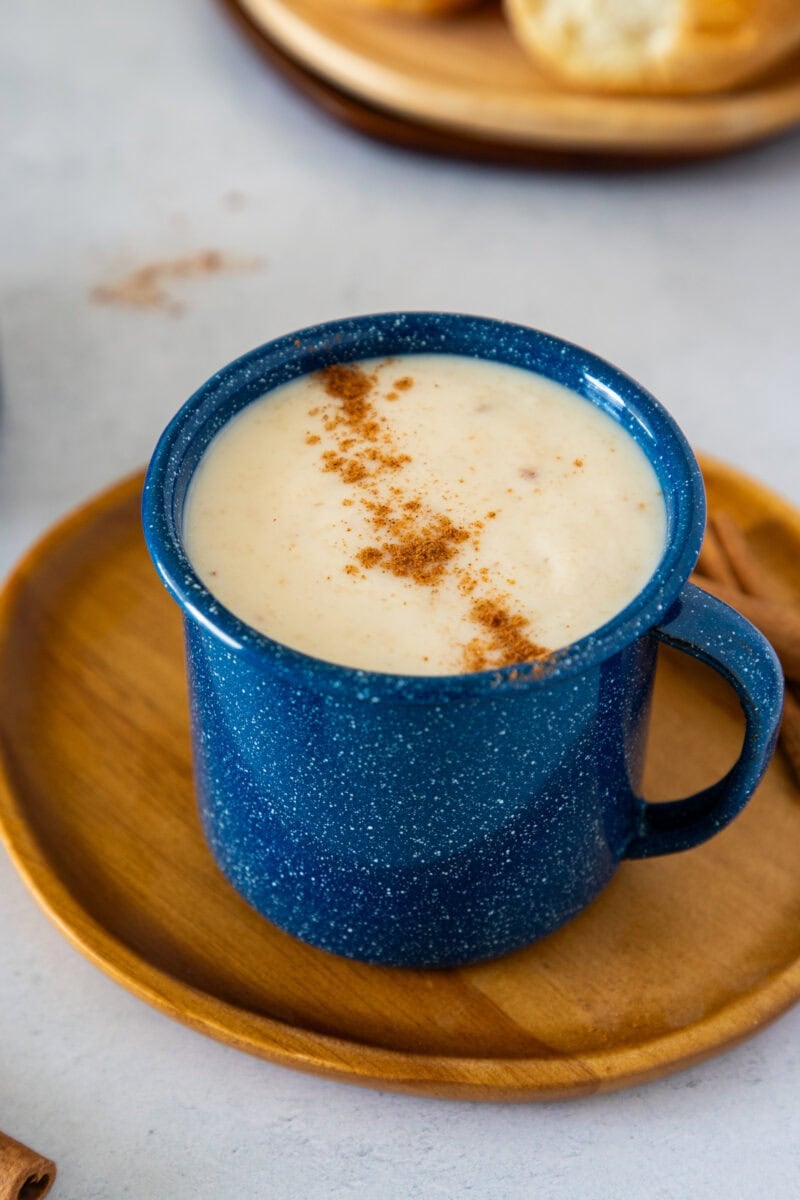 Creamy Dominican hot oatmeal topped with cinnamon in a blue mug.
