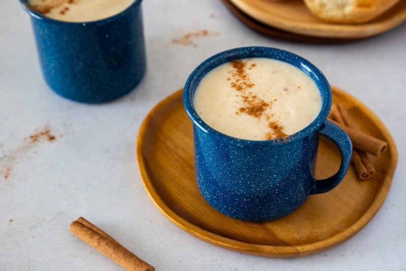 Creamy Dominican hot oatmeal topped with cinnamon in a blue mug.