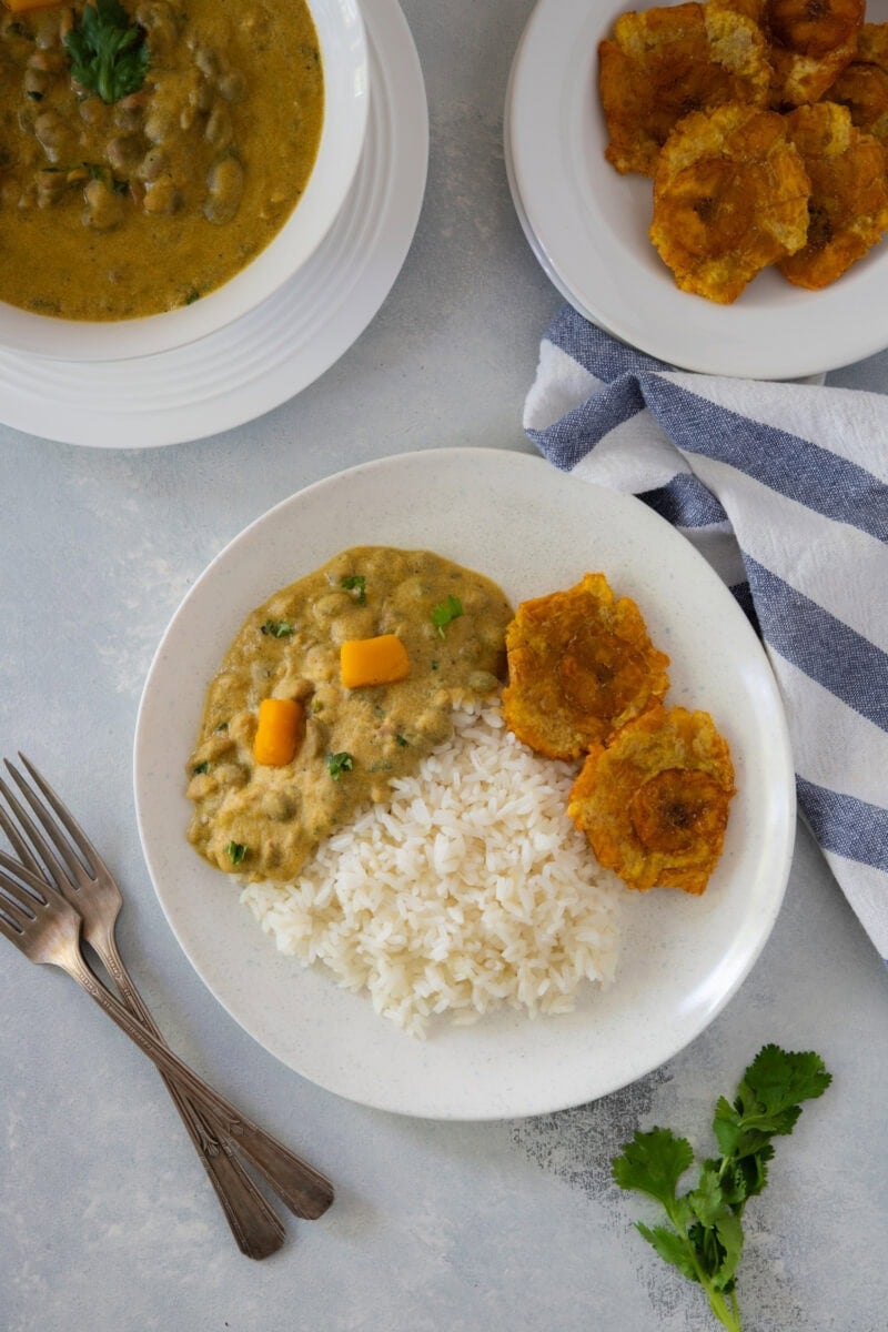 Guandules con coco served with pumpkin and tostones.
