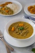 Rice with creamy guandules con coco and tostones.